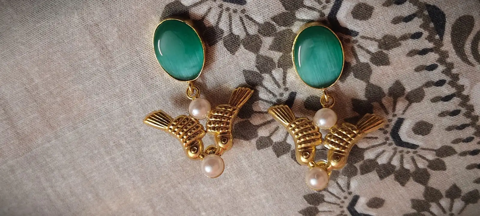 Pearl fish earrings from Saj Kotha